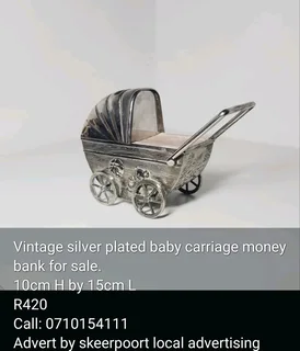 Vintage silver plated baby carriage money bank for sale