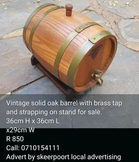 Vintage solid oak barrel with brass tap on stand for sale