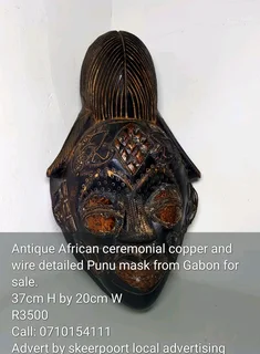 Antique African ceremonial copper and wire detailed punu mask from Gabon for sale