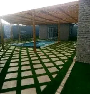 Artificial grass and paving.
