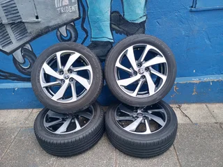 A Set of 16inche Rims And TYRES Toyota Starlet