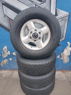 A Set Of 16inche Rims And Tyres Nissan Np300 Original Mags