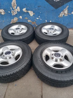 A Set of 16inche Rims And TYRES NISSAN NP300 Original mags