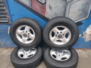 A Set of 16inche Rims And TYRES NISSAN NP300 Original mags