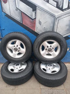 A Set of 16inche Rims And TYRES NISSAN NP300 Original mags