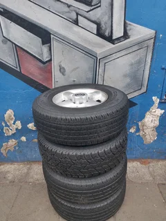 A Set of 16inche Rims And TYRES NISSAN NP300 Original mags