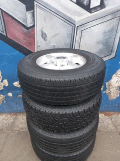 A Set of 16inche Rims And TYRES NISSAN NP300 Original mags