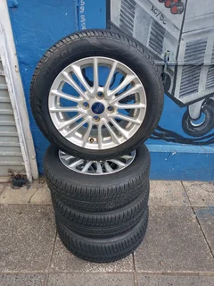 A Set of Rims And TYRES 15inche Ford Figo and Ford Fiesta Original mag 4X108 Pcd