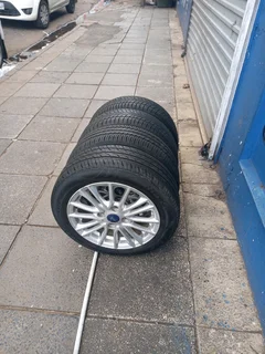 A Set of Rims And TYRES 15inche Ford Figo and Ford Fiesta Original mag 4X108 Pcd