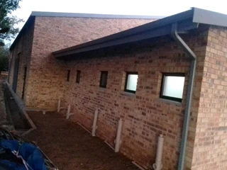 ALL GUTTERING AND COVERING OF PILLARS