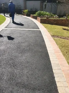 PAVING ROADS N DRIVEWAYS