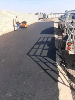 PAVING ROADS N DRIVEWAYS