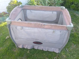 Cot Secondhand (some tears) No mattress etc and needs a clean R95