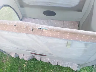 Cot Secondhand (some tears) No mattress etc and needs a clean R95