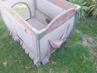 Cot Secondhand (some tears) No mattress etc and needs a clean R95
