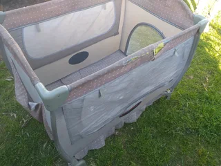 Cot Secondhand (some tears) No mattress etc and needs a clean R95