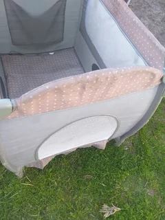 Cot Secondhand (some tears) No mattress etc and needs a clean R95