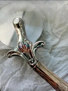 Vintage Silver Plated Pizza Cutter R149The item measures 19cm