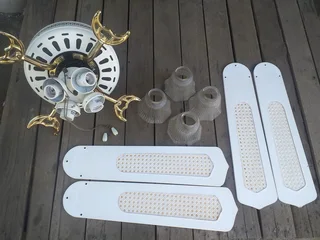 Ceiling fan 4 finWorking conditionNeeds globes Might need some screws R699