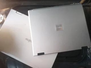 2 Very Old Laptops Both Boken Not Working(the Ones Screen Is Totally Damaged And 1 Button Missing