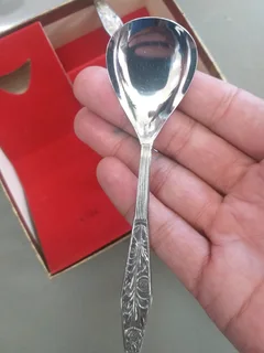 boxed set of a tea strainer with a porcelain bowl and a matching spoon &#34;Novalux Plate&#34;