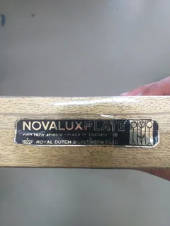 boxed set of a tea strainer with a porcelain bowl and a matching spoon &#34;Novalux Plate&#34;