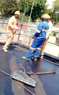 Aluminum gutters and waterproofing torch on roof repair leaks