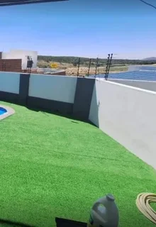 Buffalo instant roll on lawn grass and artificial turf grass