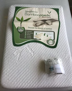 Snuggletime Bamboopaedic Mattress Stamdard camp cot and Xoxobaby fitted sheet