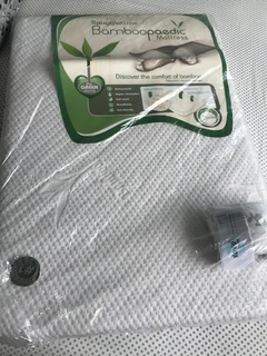 Snuggletime Bamboopaedic Mattress Stamdard camp cot and Xoxobaby fitted sheet