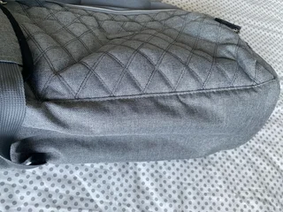 Woolworths nappy bag, thermal compartments and bottle holder, a mat