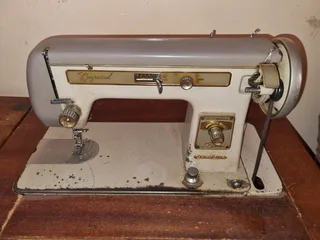 Empisal GoldLine Model GL-2E antique sewing machine with cabinet