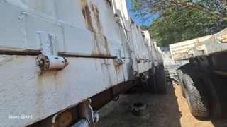 Low priced Tri axle flat deck trailer