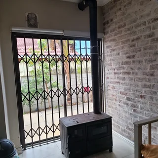 Wood burning Cast iron fireplace/heater with oven.