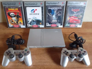 Ps2 plus 2 remotes and 4 games