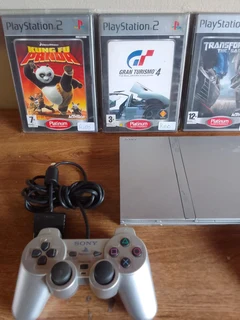 Ps2 plus 2 remotes and 4 games