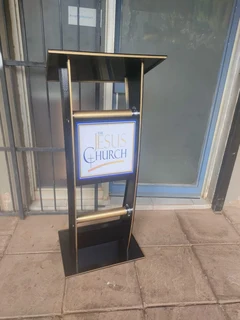 Black C-shaped Pulpit With Golden Edges And Poles