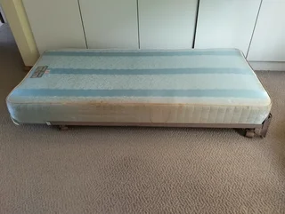 2 X base mattresses with wheeled metal frames for sale