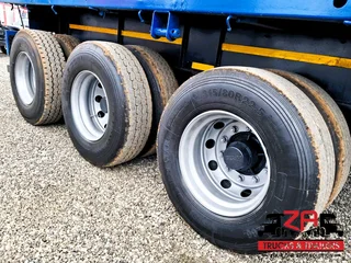 2013 PARAMOUNT TRI-AXLE FLAT DECK TRAILER