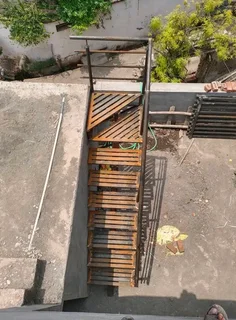 Metal stairs and landing outside a private house for access