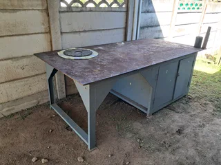 Welding table with cabinet