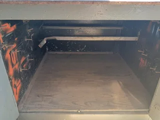 Welding table with cabinet