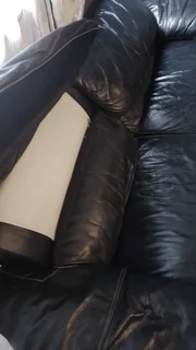 Gerald Yosh Black leather long seater couch (sears up to 4)