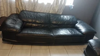 Gerald Yosh Black leather long seater couch (sears up to 4)
