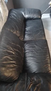 Gerald Yosh Black leather long seater couch (sears up to 4)