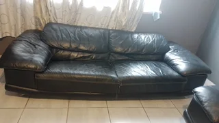 Gerald Yosh Black leather long seater couch (sears up to 4)