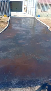 Road surfacing, road markings, fog spray, slurry seal