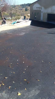 Tar surfacing and brick paving