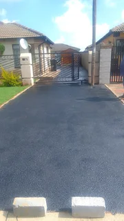 Tar surfacing and brick paving
