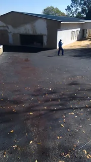 Tar surfacing and brick paving